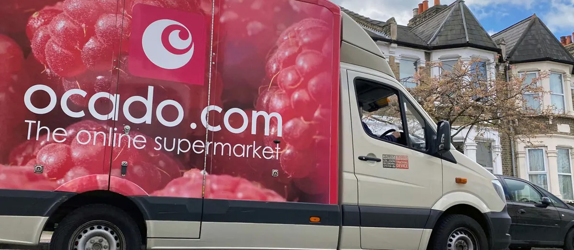 An image of an Ocado van delivering groceries